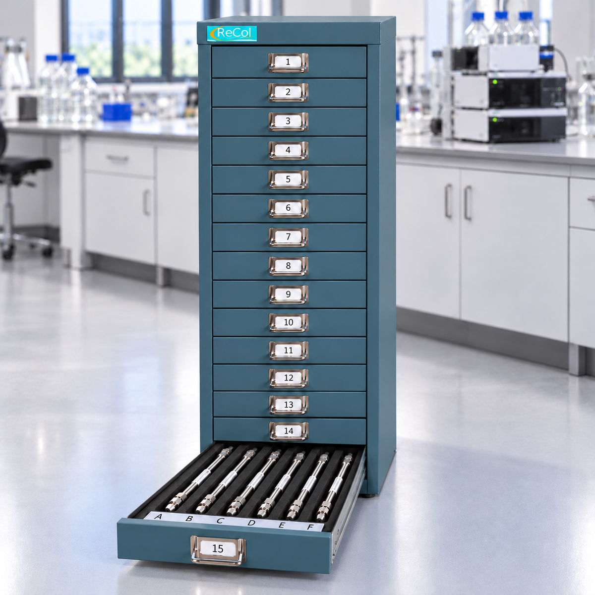 RECOL90 fifteen-drawer teal cabinet with drawer 15 extending toward the lower left, holding six HPLC columns